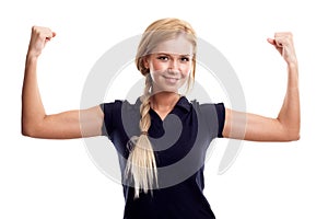 Smiling woman in sports wear showing her biceps photo