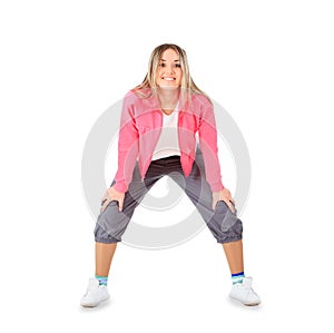 Smiling woman in sportwear isolated over white