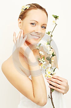 Smiling woman with spring apple flowers