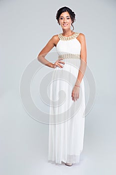 Smiling woman standing in trendy dress