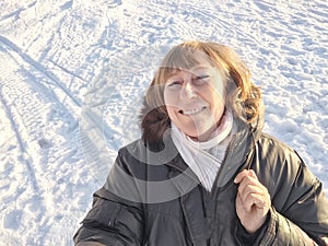 Smiling Woman on a Sunny Spring, Winter or autumn Day Outdoors on nature