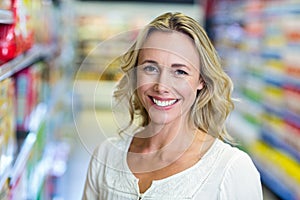 Smiling woman at the supermarket