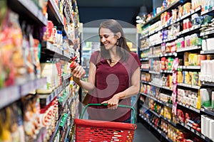 Smiling woman at supermarket photo