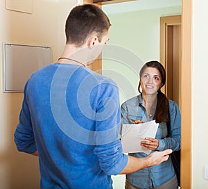 Smiling woman surveys man