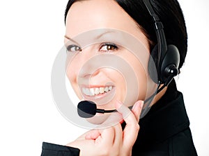 Smiling woman talking by headphone