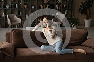 Smiling woman talking on phone, enjoying pleasant conversation with friend