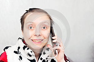 Smiling woman talking on a smartphone