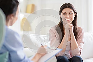 Smiling woman talking to wellness coach about motivation