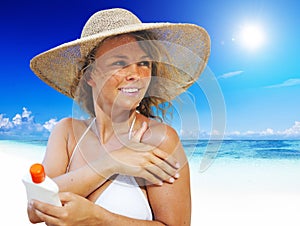 Smiling Woman Tanning By The Beach