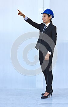 Smiling woman technical operators pointing finger