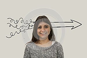 Smiling woman is thinking about process of problem solving. Scribbles turn into an arrow. Problem solving concept