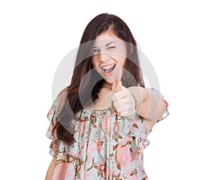 smiling woman with thumbs up gesture