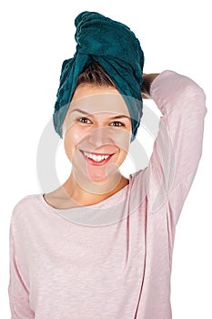 Smiling woman with towel on head