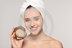 Smiling woman with towel on head