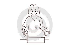 Smiling woman unpack box with order