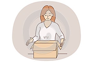 Smiling woman unpack box with order