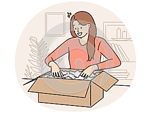 Smiling woman unpack box with order