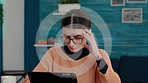 Smiling woman using digital gadget to take lecture notes