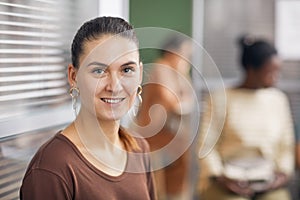 Smiling Woman Waiting in Office