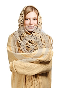 Smiling woman in warm comforter