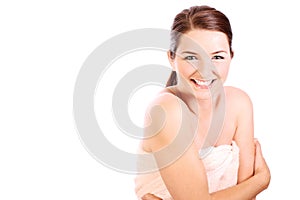 Smiling woman wearing bath towel