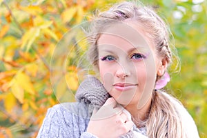 Smiling woman wearing warm sweater outdoors