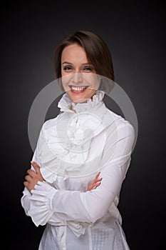 Smiling woman in white shirt frill