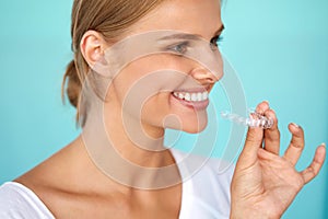 Smiling Woman With White Teeth Holding Teeth Whitening Tray