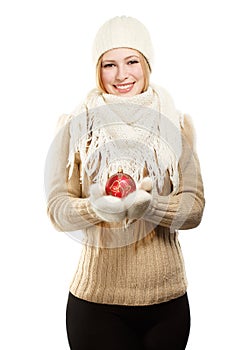 Smiling woman in winter clothing with red ball