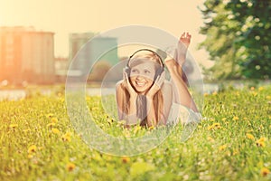 Smiling woman Woman listening to music on headphones outdoors