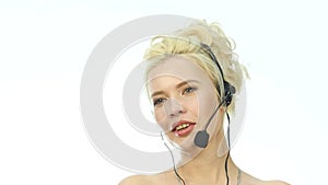 smiling woman working in a call center. Headset telemarketing woman talking on helpline. 4K