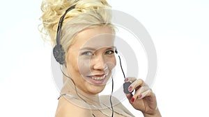 smiling woman working in a call center. Headset telemarketing woman talking on helpline. slow motion