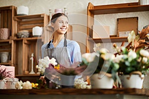 Smiling Woman Working in Flower Shop