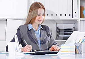 Smiling woman working in office