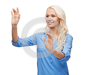 Smiling woman in working with virtual screen