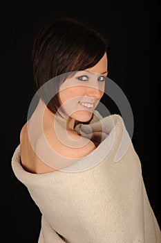 Smiling woman wrapped in towel