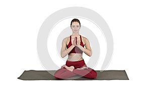 Smiling woman yoga meditating sitting lotus, hands coupled on white background.