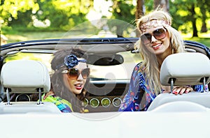 Smiling women in a cabrio photo