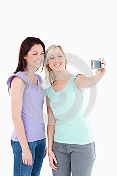 Smiling women with a camera