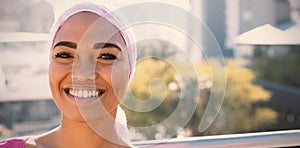 Smiling women wearing mantra scarf