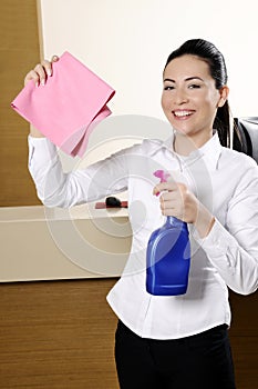 Smiling worker cleaning the hotel