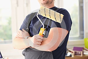 Smiling worker hold brush portrait