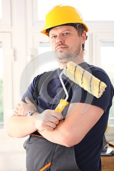 Smiling worker hold brush portrait