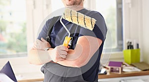 Smiling worker hold brush portrait