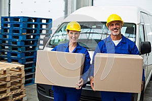 Smiling workers looking at camera