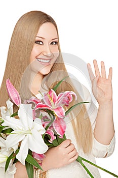 Smiling xxl woman holding flowers