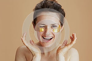 Smiling young 40 years old woman with eye patches