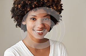 Smiling young African woman with an afro and natural complexion