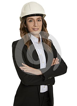Smiling young architect business woman portrait, with white helmet, arms crossed