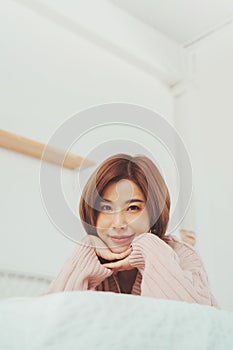Smiling Young Asian Korean female looking at camera